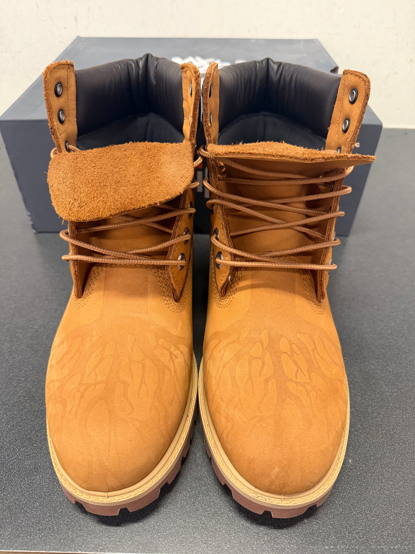 Timberland boot rooted in concrete